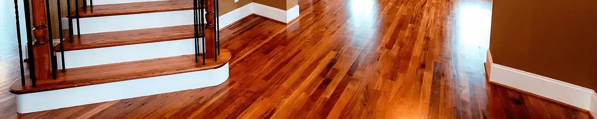 Base floor of a staircase with professionally restored wood flooring in Oklahoma City OK