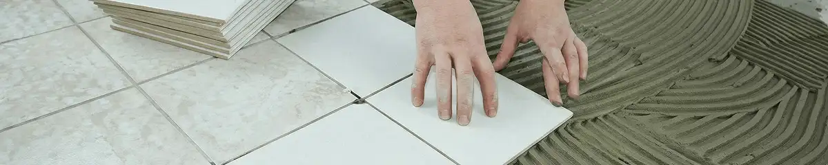 Professional installing white tile floors in Oklahoma City, OK