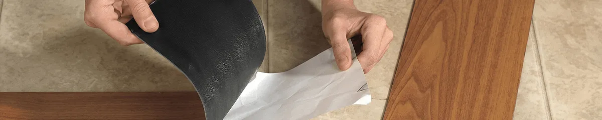 A professional installing vinyl flooring in Oklahoma City, OK