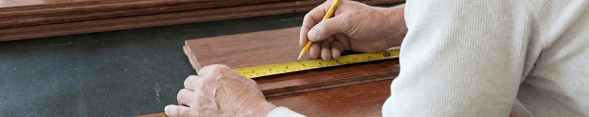 A professional installing wood flooring in Oklahoma City, OK